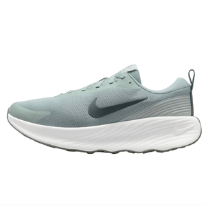 Nike running shoe with a light green mesh upper, white textured sole, and a dark Nike swoosh logo.