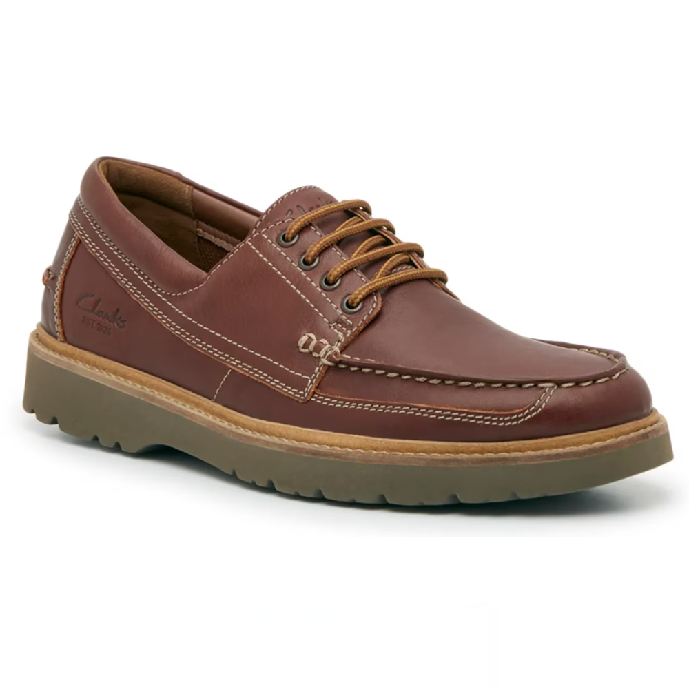 Brown leather lace-up shoe with a moccasin-style toe and durable sole, featuring stitching details and the Clarks logo on the side.
