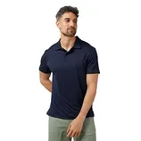 A man is wearing a navy blue polo shirt paired with light green pants.