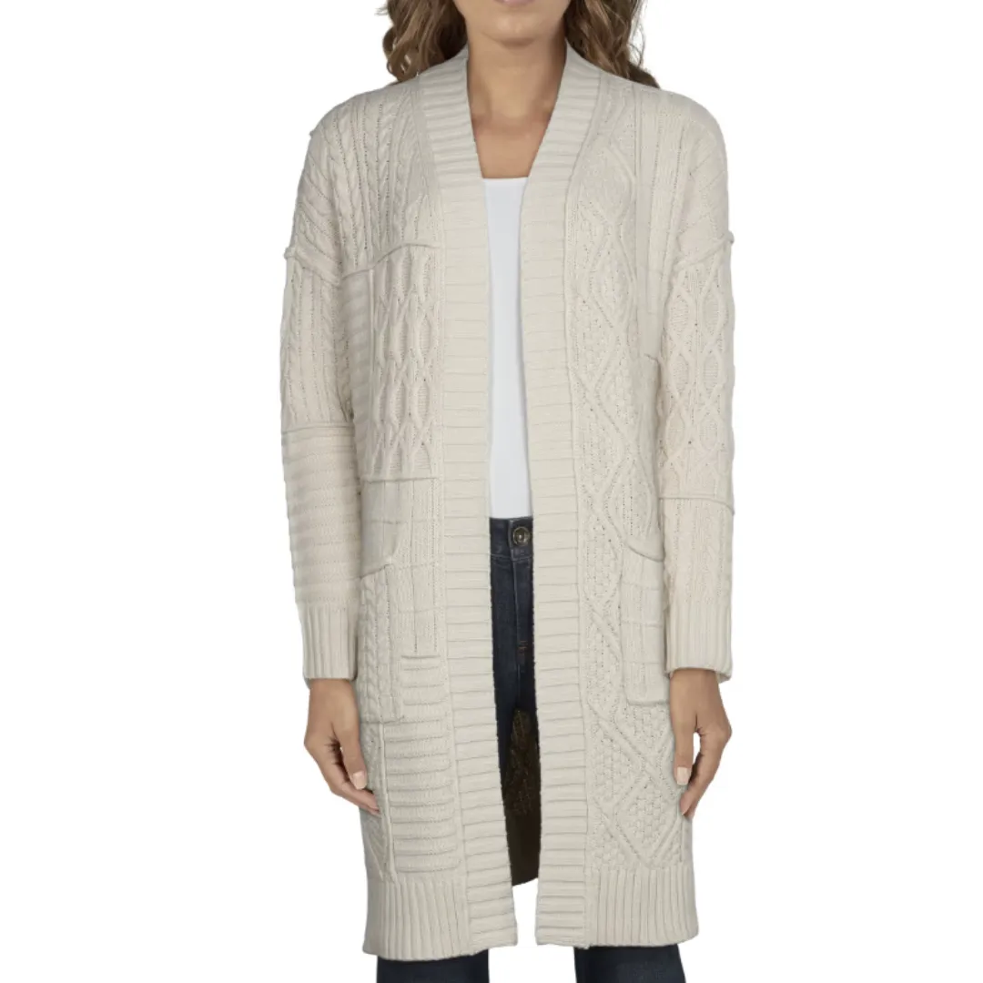 A cream cable knit cardigan with front pockets worn over a white top and jeans.