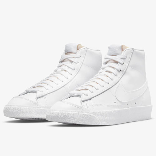 A pair of high-top white sneakers with laces.