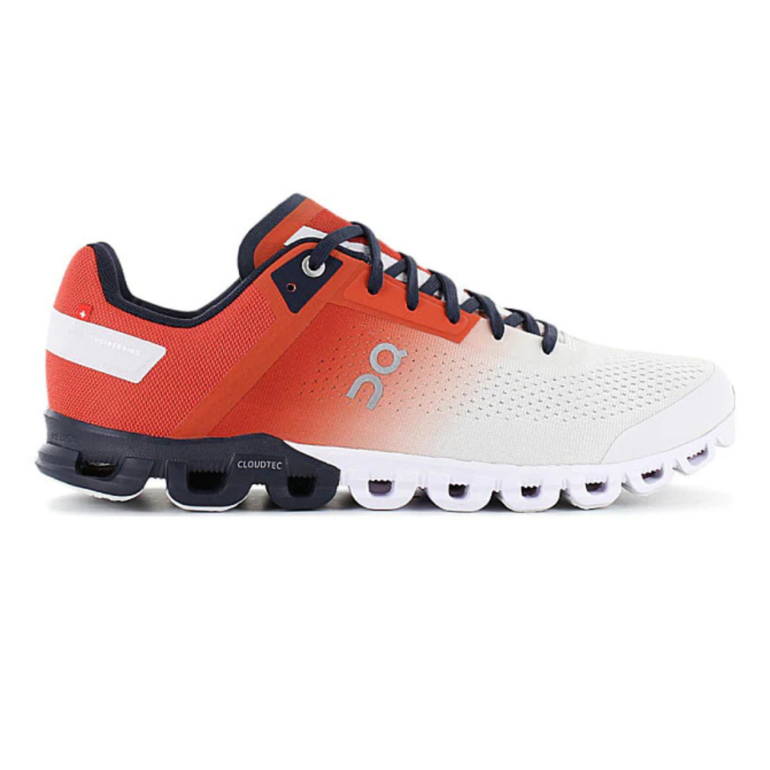 A pair of athletic shoes with a gradient design from red to white, featuring black laces and a unique CloudTec sole.