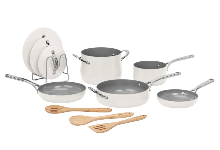Cookware set with off-white and gray non-stick pots and pans, including a stockpot, two saucepans, two frying pans, a sauté pan, four lids, and three wooden utensils.