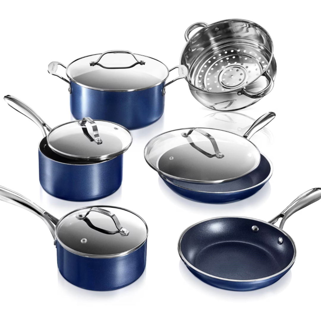 A blue cookware set with two saucepans, a stockpot, a sauté pan, a frying pan, and a stainless steel steamer insert, all featuring glass lids and shiny metal handles.