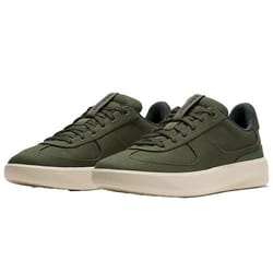 A pair of olive green casual sneakers with a low-top design and beige rubber soles.