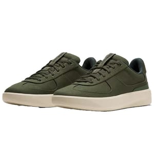 A pair of olive green casual sneakers with a low-top design and beige rubber soles.