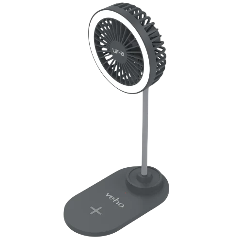 A grey desktop fan with an LED light ring, mounted on an adjustable stand with a wireless charging base, branded with \“Veho\“.