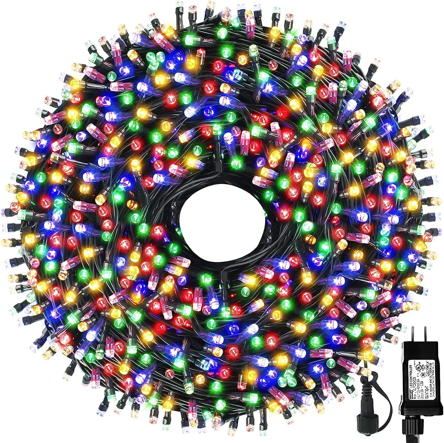 Multicolored LED Christmas lights are coiled in a circular bundle with a power adaptor visible at the top right.