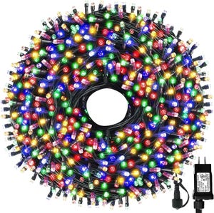 Multicolored LED Christmas lights are coiled in a circular bundle with a power adaptor visible at the top right.