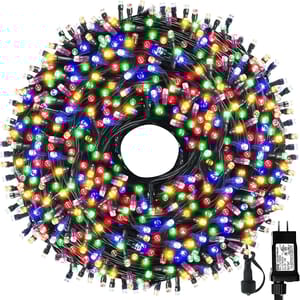 Multicolored LED Christmas lights are coiled in a circular bundle with a power adaptor visible at the top right.