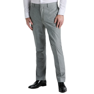 A pair of gray dress pants worn with a white shirt and black dress shoes.