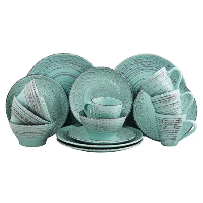 A 16-piece dinnerware set in turquoise with textured, rustic detailing, including plates, bowls, and mugs.