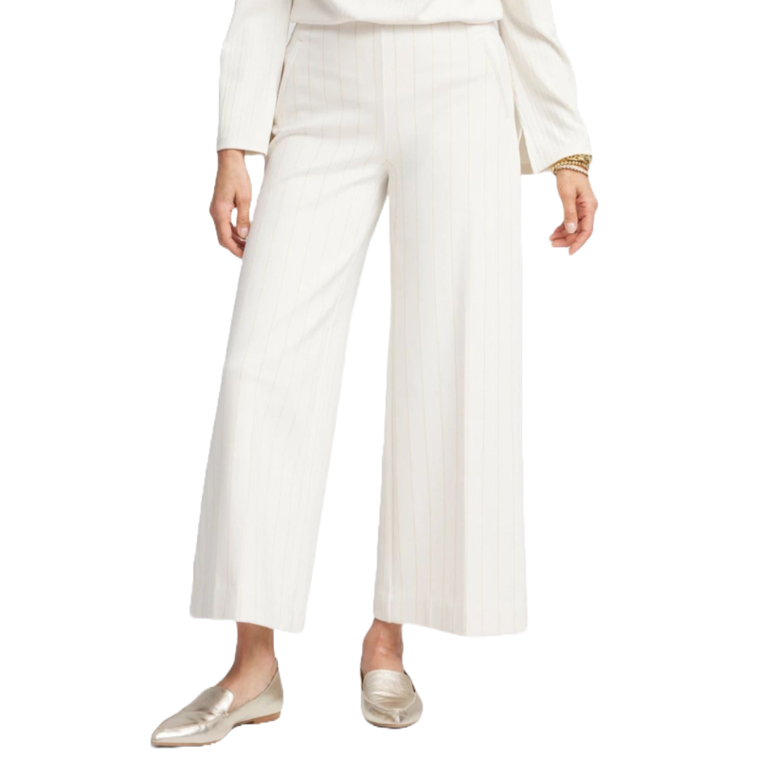 Juliet 360 Pinstripe Wide-Leg Pants are white with subtle pinstripes, featuring a high waist and loose, flowing silhouette. Paired with metallic loafers.