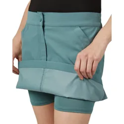 A teal athletic skort with an adjustable length feature, including shorts underneath for active use.