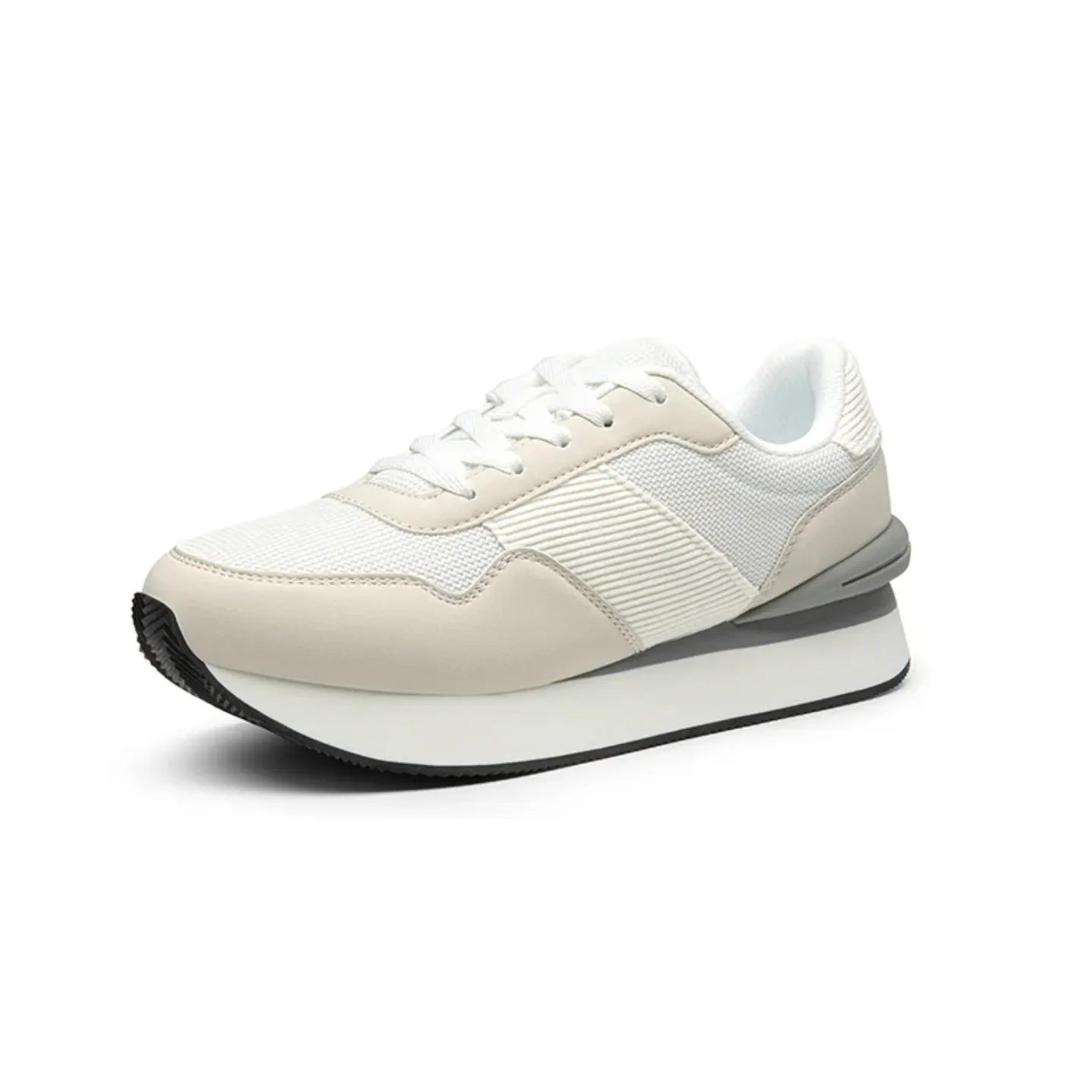 A pair of women's platform sneakers in shades of white and beige with a textured pattern on the sides and a thick, slightly elevated sole.