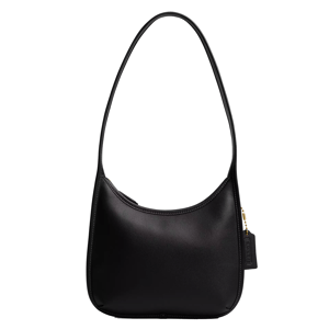 A black shoulder bag with a minimalist design, featuring a long strap and a gold zipper with a tag detail.