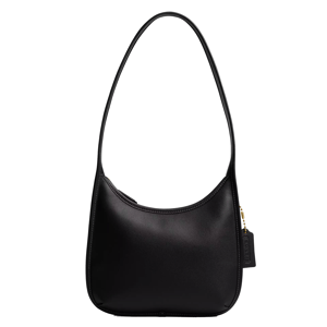 A black shoulder bag with a minimalist design, featuring a long strap and a gold zipper with a tag detail.