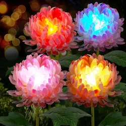 Four artificial LED-lit flowers with vibrant, multicolored petals are displayed against a dark background with soft light bokeh.