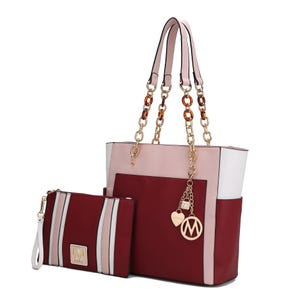 MKF Faux-Leather Tote & Wristlet in burgundy, pink, and white combination, features gold-tone chain handles and logo charms. The set includes a structured tote and a matching wristlet with a prominent M logo.