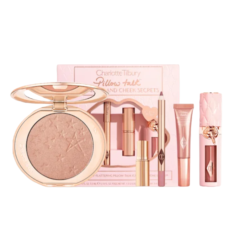 Charlotte Tilbury Pillow Talk Lip and Cheek Secrets set includes a highlighter compact with star embossing, lip liner, lip gloss, lipstick, and a mini lip cheat pencil, all in pink packaging.