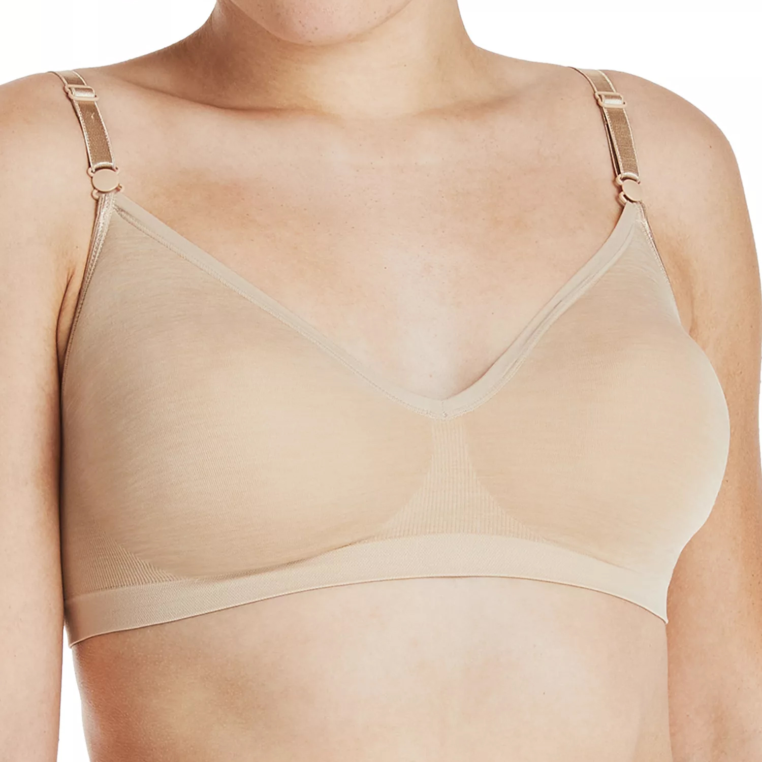 A beige, seamless, wire-free bra with adjustable straps designed for comfort and support.