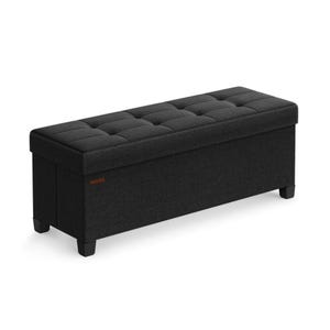 A black upholstered storage bench with a tufted top and four legs, suitable for seating and storage purposes.