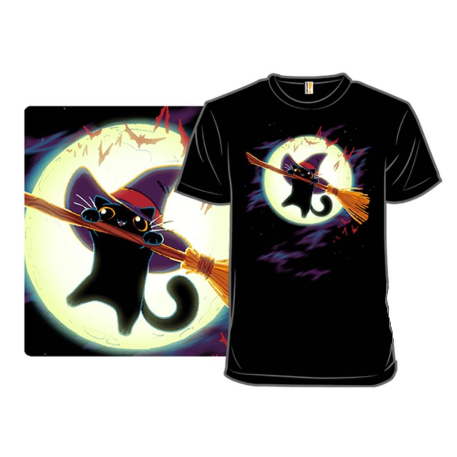 A black t-shirt features a whimsical design of a black cat wearing a witch hat, flying on a broomstick against a full moon backdrop with bats.