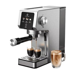A stainless steel espresso machine featuring a portafilter, control knob, and steam wand is shown making two espresso shots, with a glass of coffee beside it.