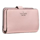 A pink leather wallet with a pebbled texture, featuring the \“kate spade new york\“ logo embossed on the front.