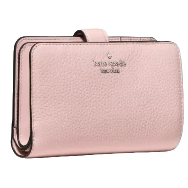 A pink leather wallet with a pebbled texture, featuring the \“kate spade new york\“ logo embossed on the front.