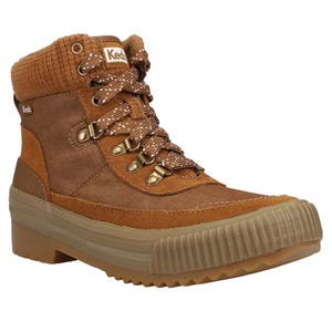 Brown Keds ankle boot with a ribbed rubber sole, corduroy cuff, and metal eyelets for the laces.