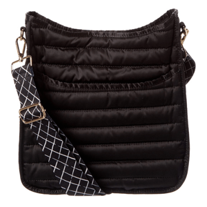 A black quilted crossbody bag with a wide, adjustable strap featuring a white geometric pattern.