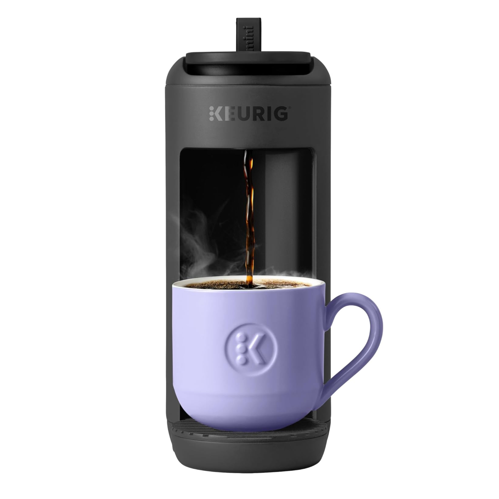 Keurig coffee maker pouring steaming coffee into a lilac mug with the Keurig logo.