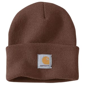 Brown Carhartt winter beanie with a folded cuff featuring a sewn-on square white patch displaying the Carhartt logo in orange. Made of soft, knit material for warmth.