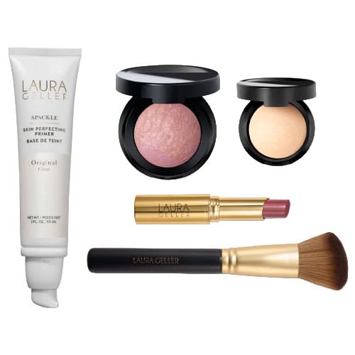 Laura Geller makeup set featuring Spackle Skin Perfecting Primer, Baked Blush, Baked Highlighter, a lipstick, and a face brush.