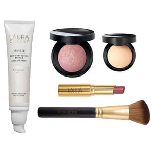 Laura Geller makeup set featuring Spackle Skin Perfecting Primer, Baked Blush, Baked Highlighter, a lipstick, and a face brush.