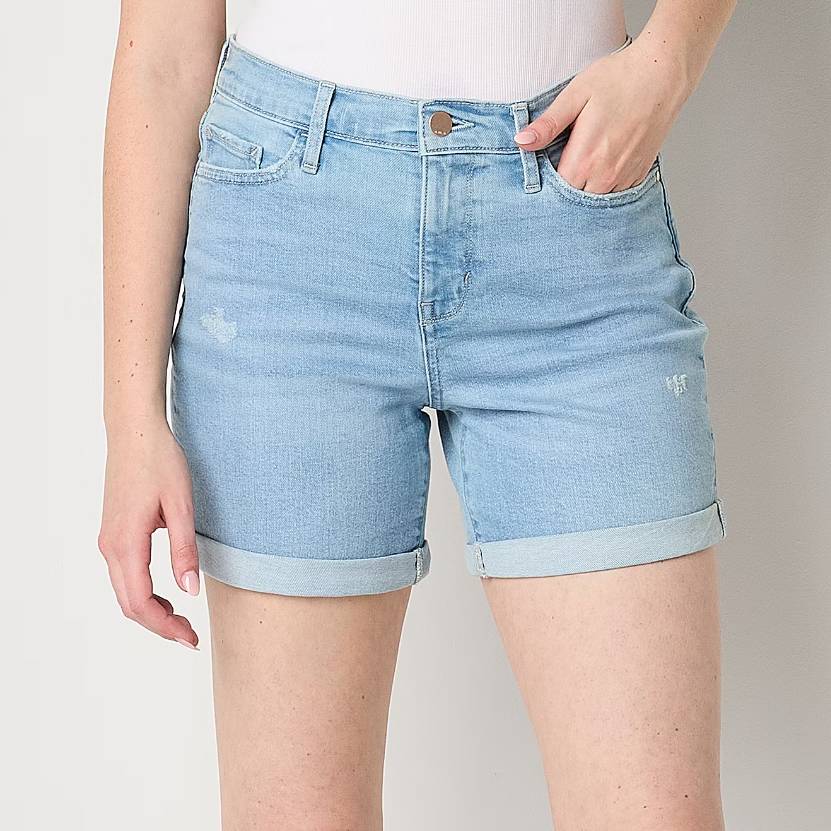 A pair of light blue denim shorts with a rolled-up hem and slight distressing.