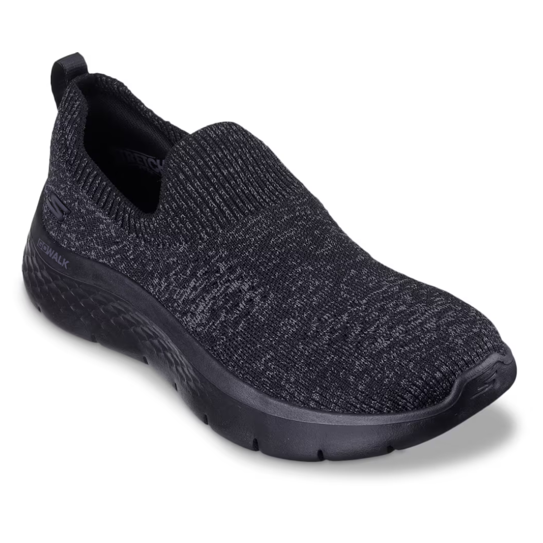 A single black slip-on sneaker with a knit upper and rubber sole.
