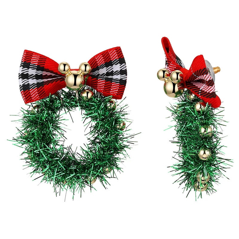 Festive Mickey Mouse earrings featuring a green tinsel wreath adorned with small golden bells, topped with a red plaid bow.