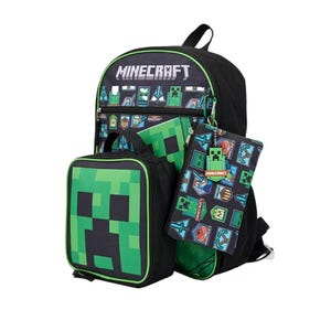 A Minecraft-themed backpack set featuring a Creeper design, including a lunchbox, pencil case, and keychain, all adorned with game motifs and characters.