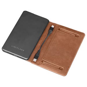 A sleek, brown leather RFID wallet with an integrated power bank featuring a USB cable for charging devices, embossed with \“LIMITLESS.\“