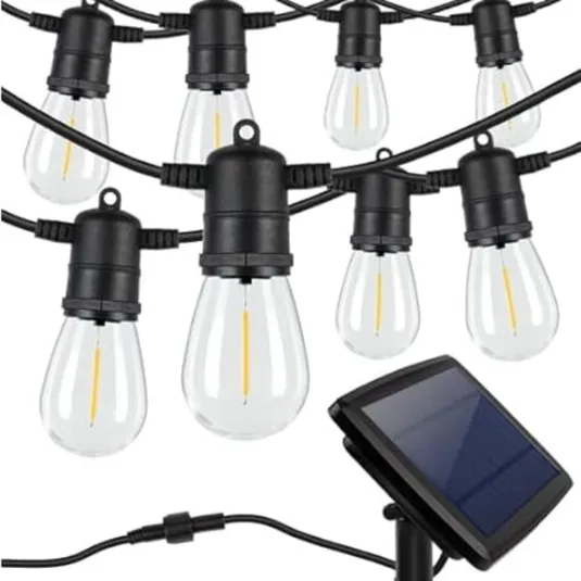 String lights with hanging bulbs and a solar panel for outdoor use.