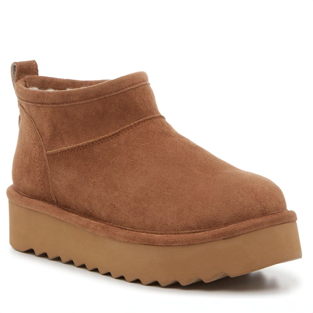 Brown suede ankle booties with a chunky platform sole and a ridged tread, featuring elastic side panels for slip-on entry.