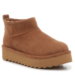 Brown suede ankle booties with a chunky platform sole and a ridged tread, featuring elastic side panels for slip-on entry.