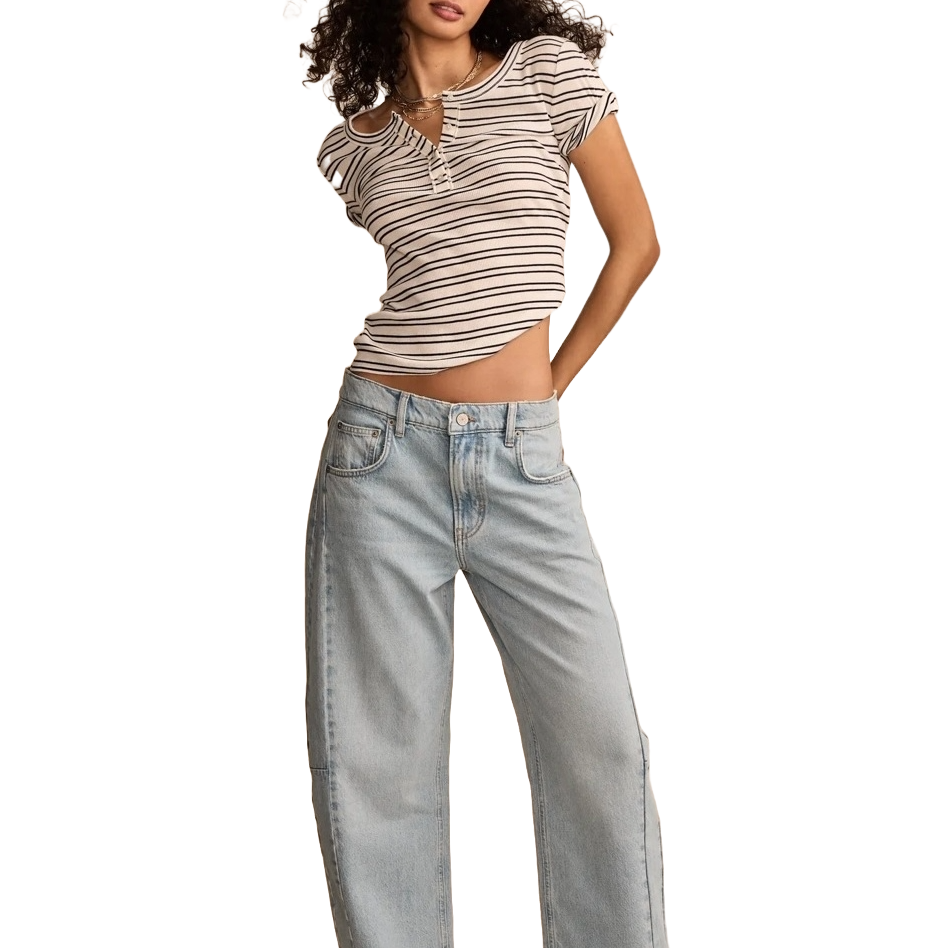 A person is wearing a striped short-sleeve top with a keyhole detail and light-wash, loose-fitting jeans.