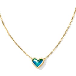 Gold chain necklace with a heart-shaped, iridescent blue-green charm set in gold.