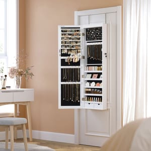 A wall-mounted jewelry organizer with open doors displaying necklaces, earrings, and cosmetics.