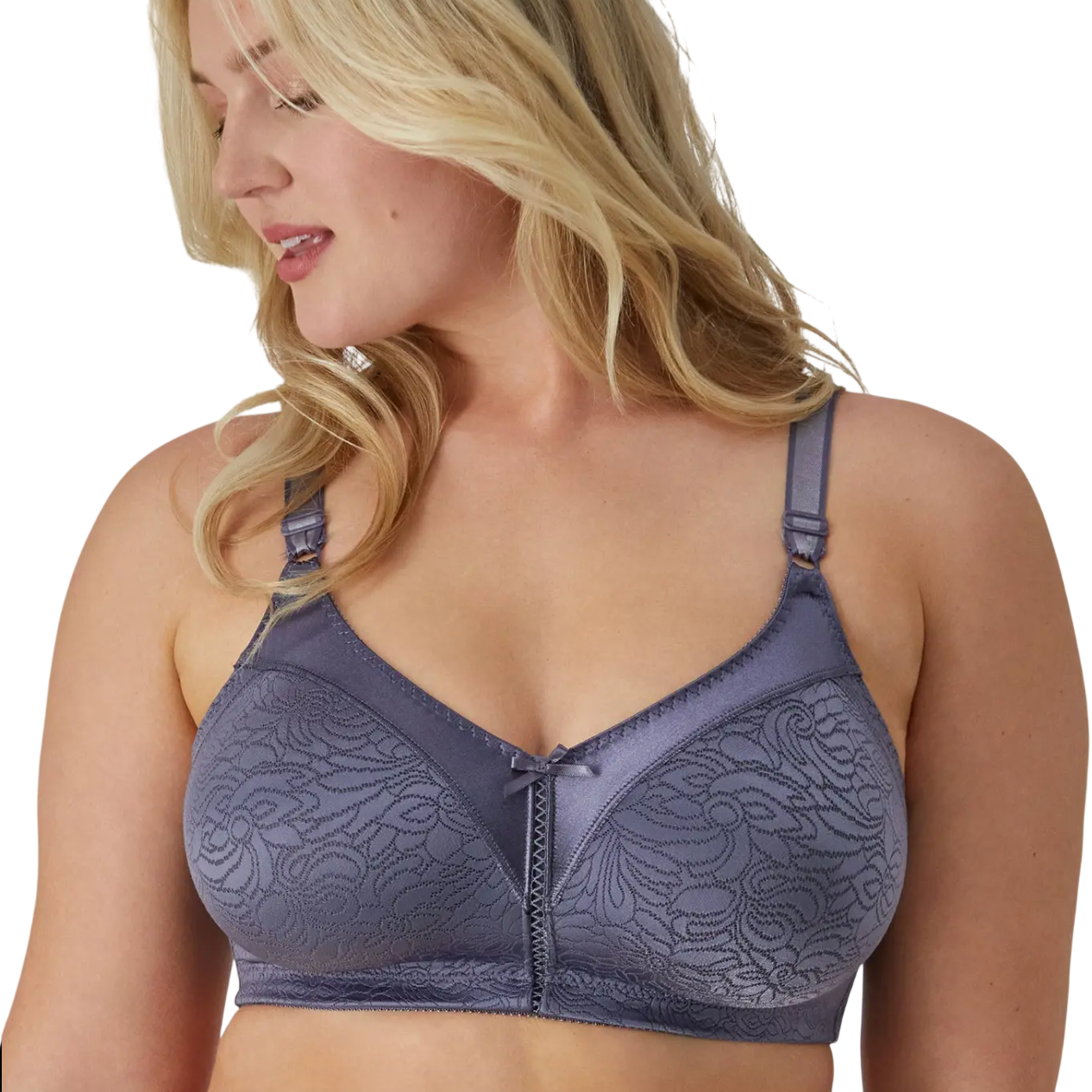 A woman wearing a purple lace-patterned bra with adjustable straps and a small bow at the center.