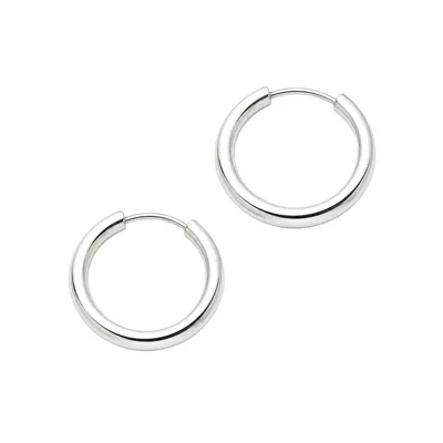 A pair of silver-tone hoop earrings with a smooth, polished finish.
