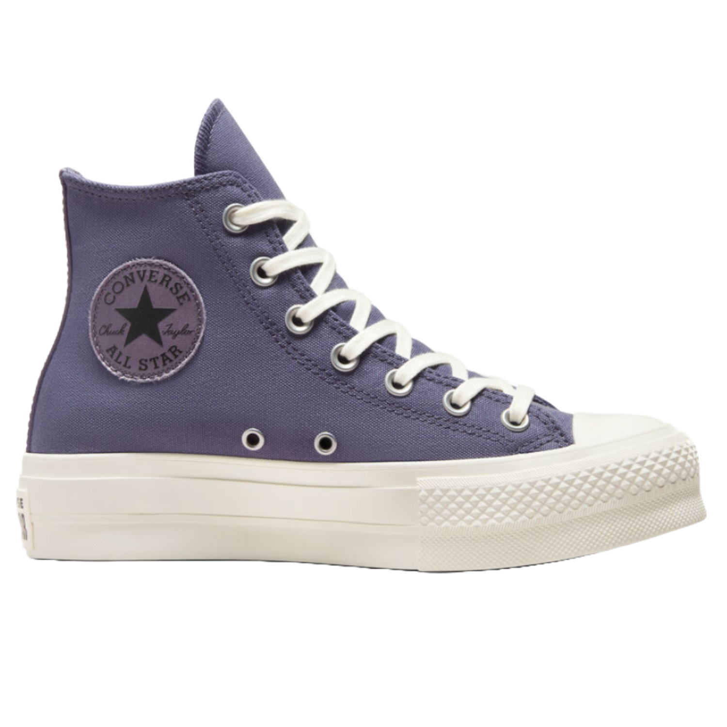 Converse All Star Lift Platform Shoes in a high-top style feature a canvas upper in purple with white laces and eyelets, a rubber toe cap, and a thick white platform sole, showcasing the iconic \“Converse All Star\“ logo on the side.